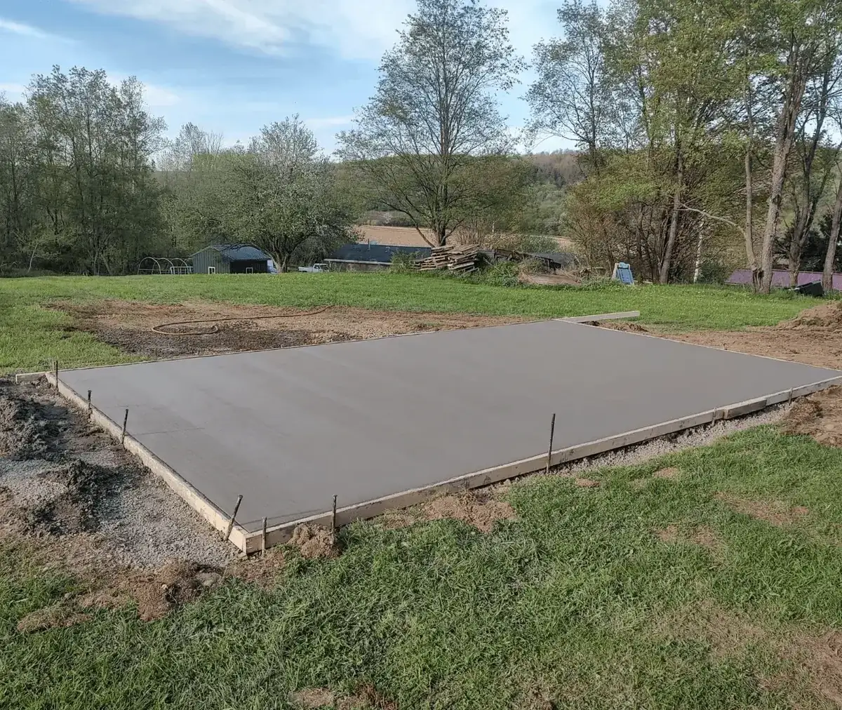 Freshly poured and formed concrete building pad in a rural Western New York field by Liberty Pour Concrete