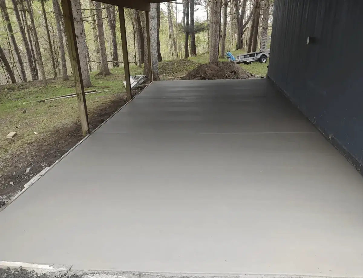 Covered concrete patio slab poured alongside a barn in East Elma NY — Liberty Pour Concrete